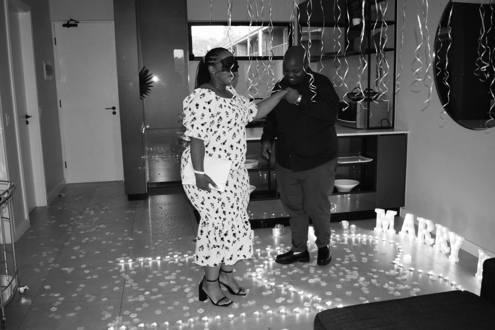 Black-and-white photograph of the proposal celebration