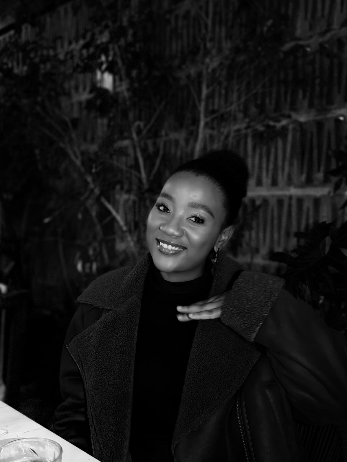 A Bridesmaid — black-and-white evening portrait of a woman with her hair in a bun